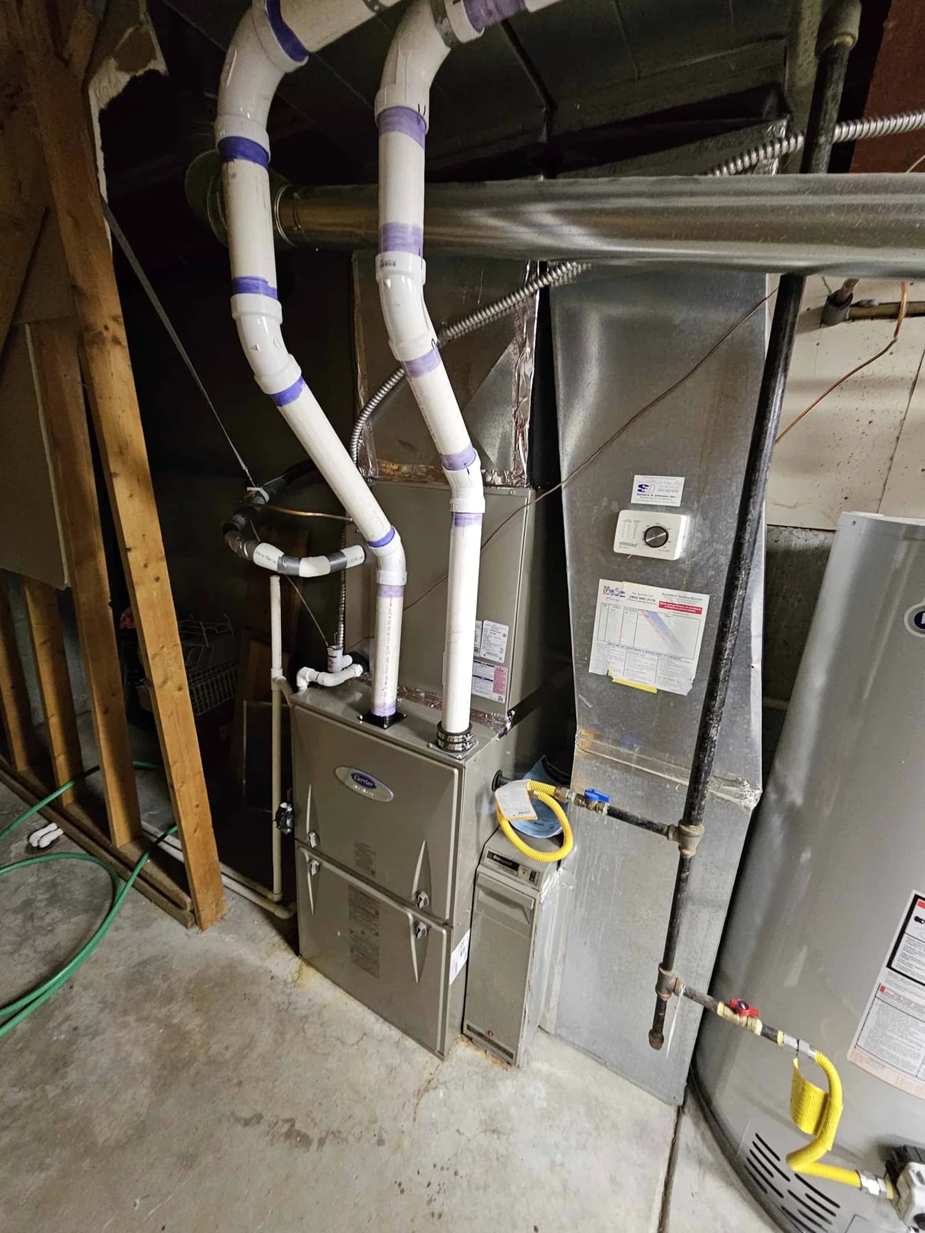 Indoor furnace and cooling coil connected to basement ductwork